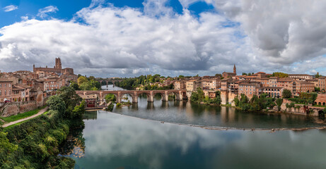 Fototapeta premium Sainte Cécile cathedral and the banks of the Tarn, from the Pont Neuf in Albi, in the Tarn, in Occitanie, France