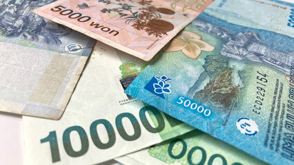 Korean and Indonesian banknotes displayed together, highlighting a blend of two currencies and cultures