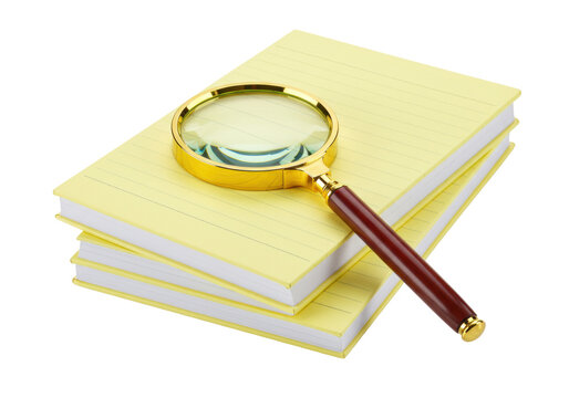 Isolated stack of yellow legal pads with magnifying glass for study or investigation