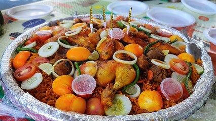 Kebuli rice with grilled chicken, boiled egg, onion and chili