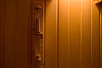 Obraz premium Hourglass on the wall in the sauna.