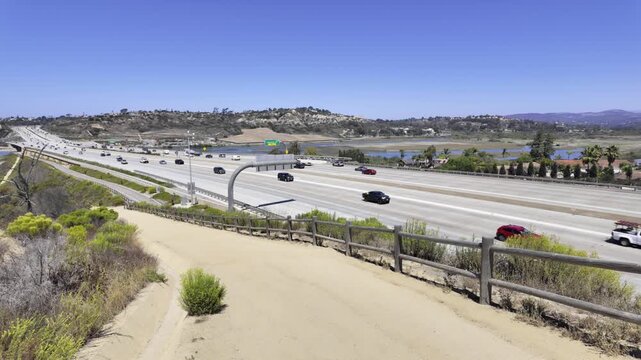 Annie&rsquo;s Canyon Trail overlooking Interstate 5 in Solana Beach. Blends nature and infrastructure, showing moving traffic beside preserved wetlands and hiking trails along California&rsquo;s coastal corridor.