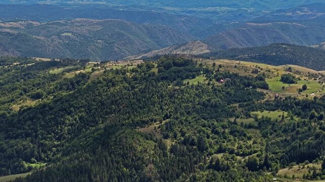 Aerial View of Picturesque Mountain Hills, Pine Forest and Village Homes on Sunny Day, Zlatibor, Serbia
