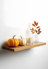 Create warm autumn ambiance with pumpkins candle and autumn leaves
