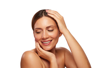 Naklejka premium A woman smiles gently as she enjoys a moment of self-care, showcasing her glowing skin while engaging in a skin care ritual. Her relaxed demeanor highlights the importance of beauty and wellness.