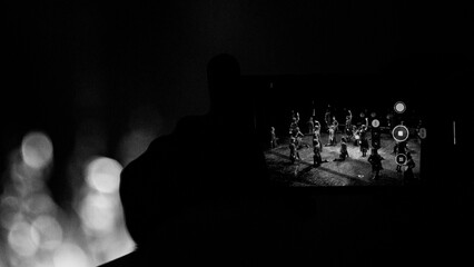 black and white photo of dancers seen through a smartphone screen