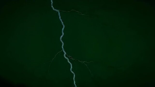 Rapid multiple lightning strikes across a dark green screen, dramatic slow motion, powerful energy fantasy, graphic element, compositing