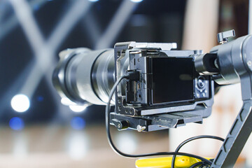 Professional camera setup with lens ready for event photography indoors