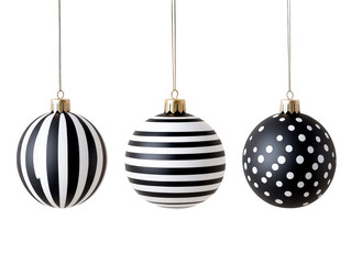 Ornamental Trio: Three festive ornaments with striking black and white patterns are suspended delicately, evoking the spirit of celebration and joy. 
