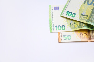 Clean and simple composition of euro money on a white background with copy space. Perfect for illustrating finance, investment, or European economy topics in commercial and creative projects.