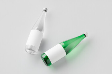 Water bottle mockup, green and clear glass, blank label