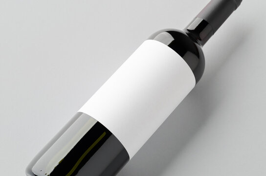 Red wine bottle mockup with blank label, closeup
