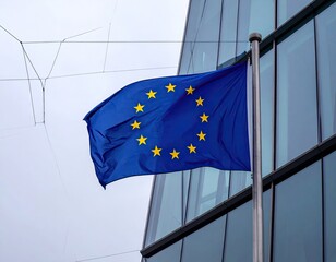 European Union flag waving outside modern building