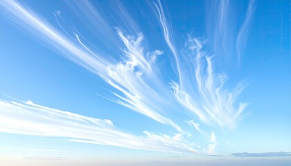 Wispy clouds streak across a vibrant blue sky