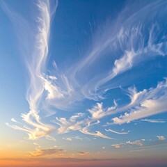 Cirrus clouds dance across a vibrant sunset sky
