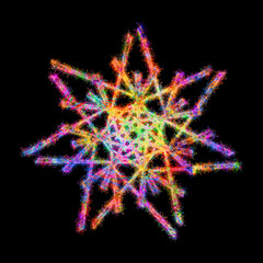 Kolorowe zimne ognie i fajerwerki układające się w kształt kolorowej śnieżynki na Boże Narodzenie.