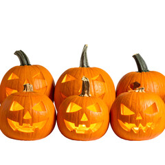 Six glowing, carved pumpkins with different jack-o'-lantern faces set against a black background