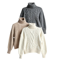 Three cable-knit turtleneck sweaters in neutral tones against a transparent background