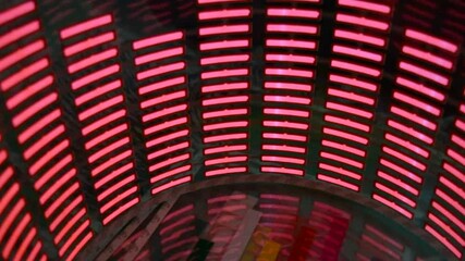 A beautiful, bright light, a red, glowing plastic sticker shaped like a real equalizer that flashes to the music. Lots of red glowing squares on a soft plastic background, a vibrant, colorful image.