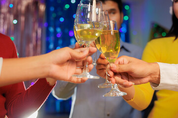 A vibrant festival atmosphere with people drinking and making a toast.
