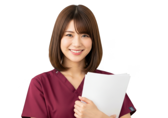 Smiling young asian woman nurse wearing scrubs holding paperwork and looking confidently ahead isolated on transparent background