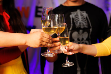 A vibrant festival atmosphere with people drinking and making a toast.