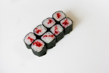 Sushi rolls with tobiko caviar on a white background
