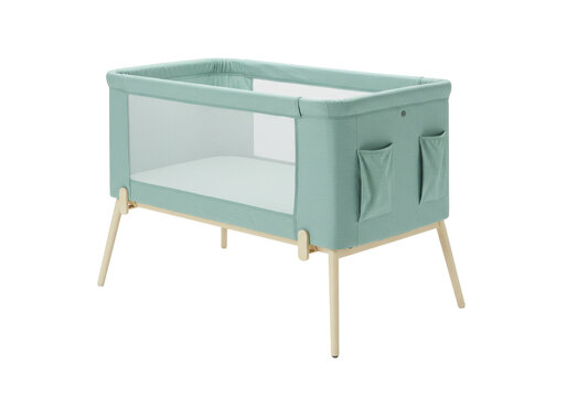 Isolated baby crib, co-sleeper bassinet, modern design; pastel colors and natural wood finish