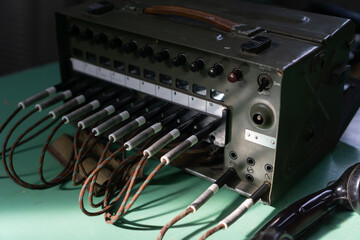 old soviet military p 193m field telephone switchboard with 10 lines and connected cords, concept of military communication, cold war, history