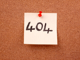 Handwritten 404 error message on a sticky note
