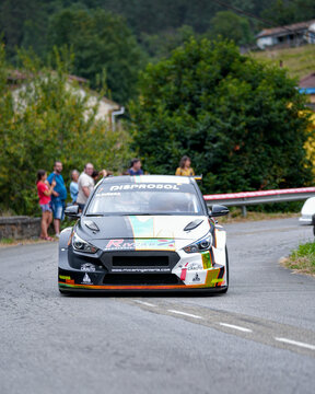 Hyundai i30 N TCR rally car competing on a winding mountain road during Rally Villa de Mieres in Asturias Spain on August 2 2025. 