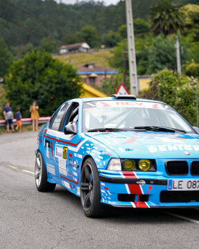 BMW E36 M3 rally car competing on a mountain road during Rally Villa de Mieres in Asturias Spain on August 2 2025. 