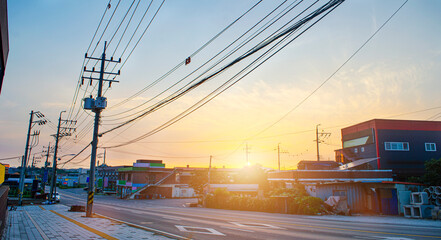 Sunset shines over the Gimpo City streets with Electric cable and pole ,countryside in South Korea