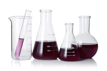 Different laboratory glassware with color liquid isolated on white