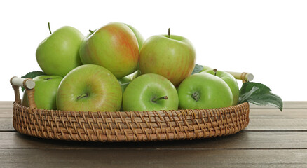 Fresh apples and green leaves on wooden table against white background