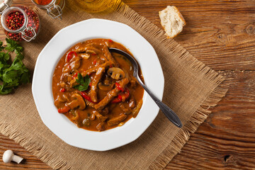 Boeuf, Stroganow, Strogonow. Classic, Russian beef stew. Served on a white plate. Top view. Natural background.