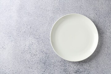 One stylish plate on grey table, top view. Space for text