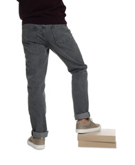 Naklejka premium Man in stylish jeans on white background, closeup