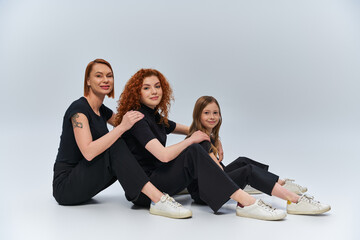 Three generations of beauty share a joyful moment in cozy autumn outfits