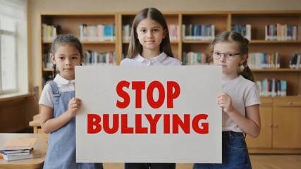 Children with a stop bullying banner at school.