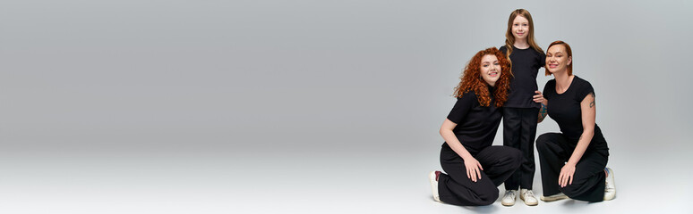 Joyful family of red haired women enjoying autumn moments together