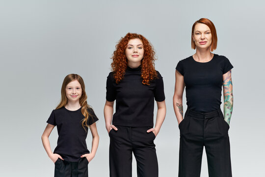 Mother, daughter, and granddaughter embrace autumn style with vibrant red hair and warmth - Powered by Adobe