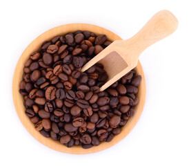 Coffee beans in wooden bowl with scoop isolated on white
