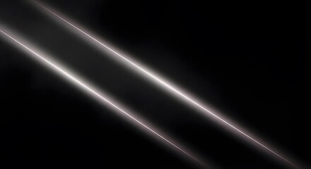 Two bright diagonal light rays shine on a dark background, creating a sense of movement and energy with a modern and abstract feel