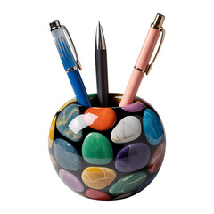A pebble patterned pen holder with three pens of different colors isolated on a black background