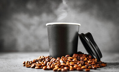 Coffee in papercup and coffee beans on gray background, aroma paper coffee cups aromatic