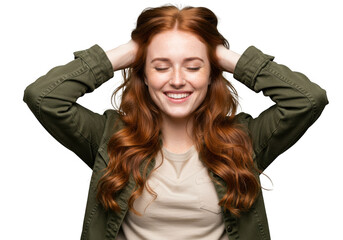 Joyful young woman with long wavy auburn hair smiling with eyes closed and hands in hair transparent background