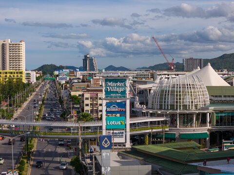 Hua Hin, Thailand - August 12, 2025: Market Village Hua Hin shopping mall and main road with city traffic and skyline