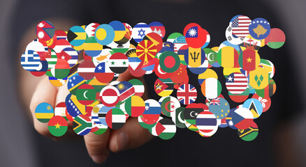 Flags of countries around the world in hand, symbolizing global concepts, international...