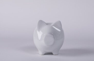 A white piggy bank on a white background, symbolizing savings, finance, and investment concepts....